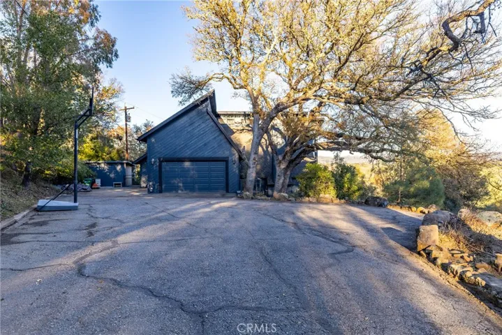 The driveway provides plenty of parking including space to park a RV, trailer or boat.