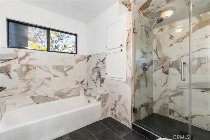 The ensuite bathroom summons you to luxuriate and decompress.
