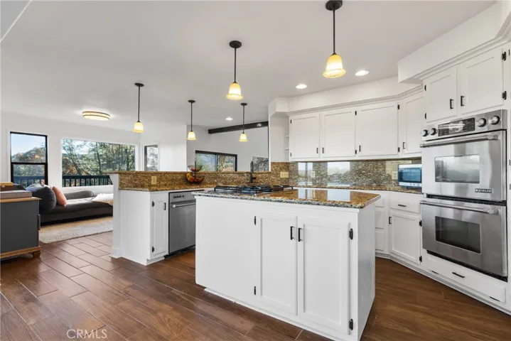 The kitchen island has additional storage and countertop space.