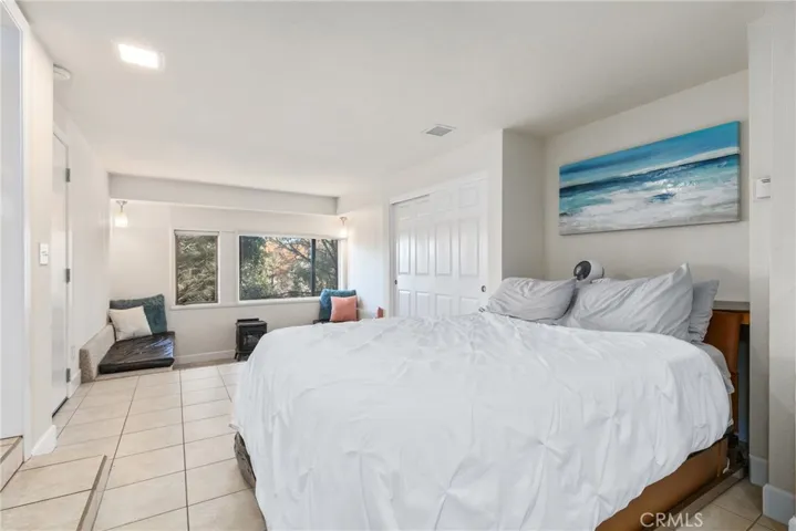 To maximize space the guest suite is equipped with a queen sized murphy bed.