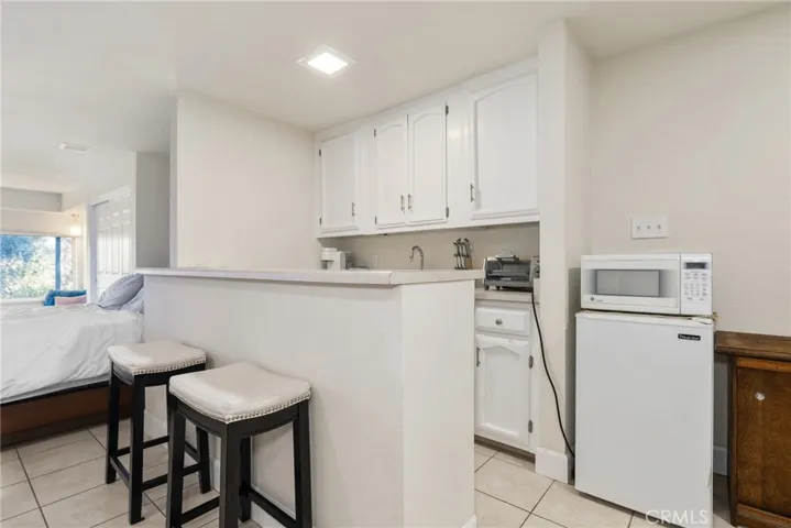 The guest suite has a convenient kitchenette with sink and storage.