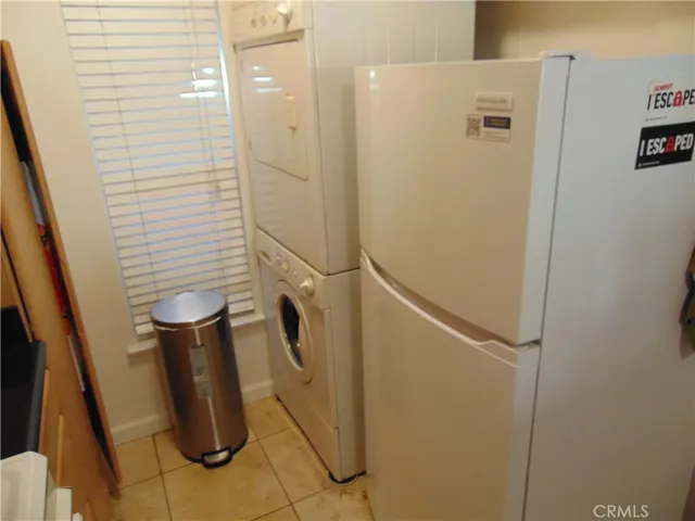 Refrigerator and stacked washer and dryer​​‌​​​​‌​​‌‌​​‌​​​‌‌​​​‌​​‌‌​​‌‌​​‌‌​​​​ included.