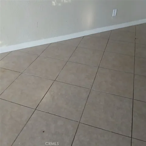 All floors tiled throughout except for bedrooms
