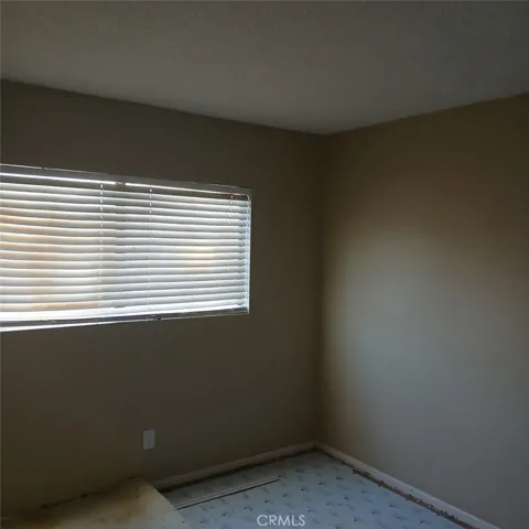 Second bedroom before new carpeting was installed