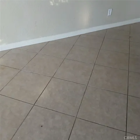 All floors tiled throughout except for bedrooms