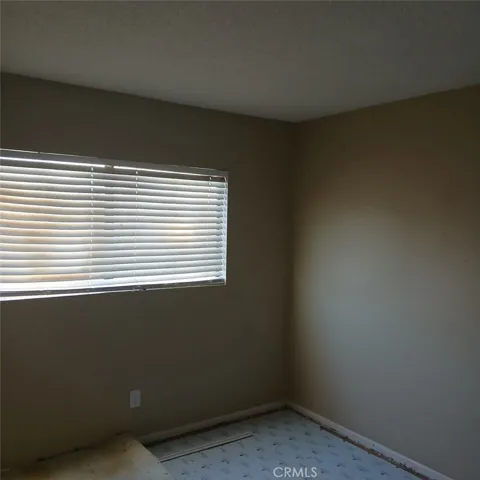 Second bedroom before new carpeting was installed