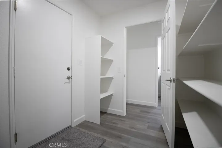 Spacious pantry offering ample storage and convenient organization for everyday kitchen needs.