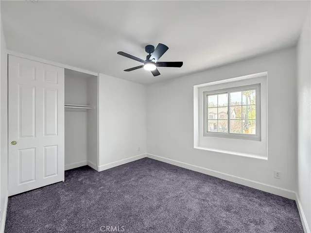 Spacious 3rd upstairs bedroom with ample space, natural light, and a welcoming atmosphere.