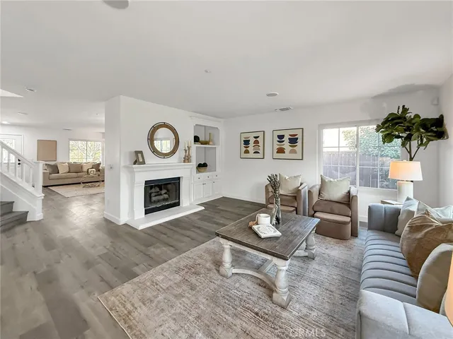 Cozy fireplace serving as a stylish focal point, perfect for warmth and gathering with family and friends.