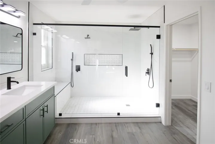 Luxurious shower with multiple showerheads, providing a spa-like experience and enhanced comfort.