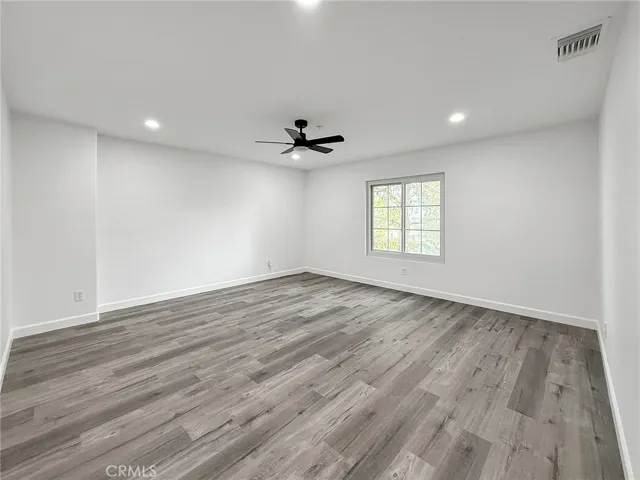 Spacious upstairs great room with natural light, flexible layout, and the option to easily convert back into a 5th bedroom if desired.