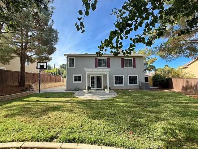 Full view of the spacious, landscaped backyard, offering plenty of room for outdoor activities, entertaining, and relaxation.