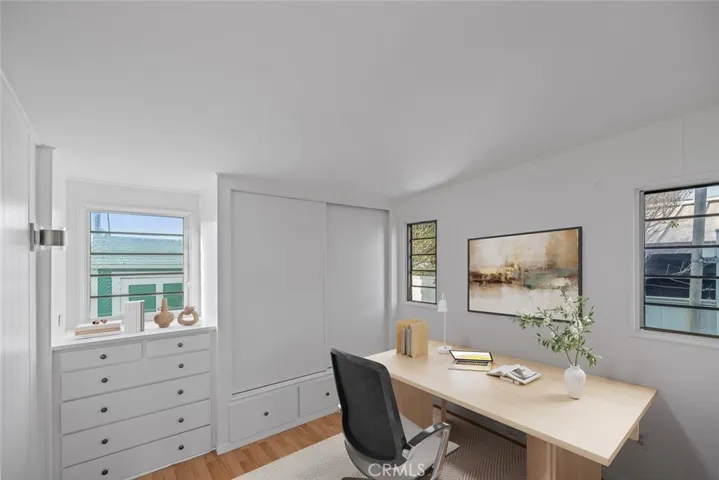 Virtually staged bedroom 2 as an office