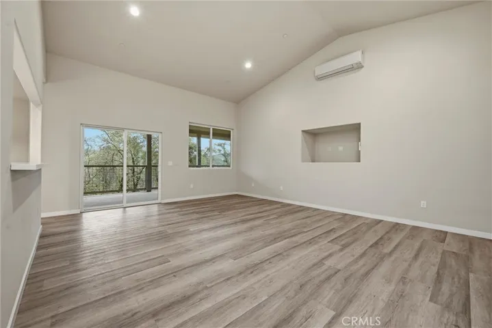 Living area has sliding door to covered back deck.