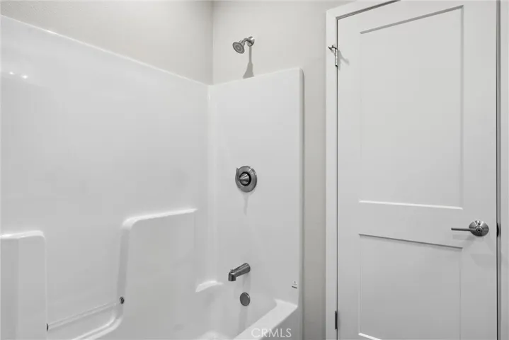 Shower over tub in Jack and Jill bathroom.