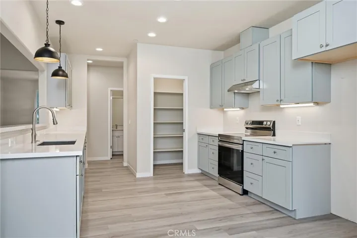 Kitchen has lots of quartz counters.