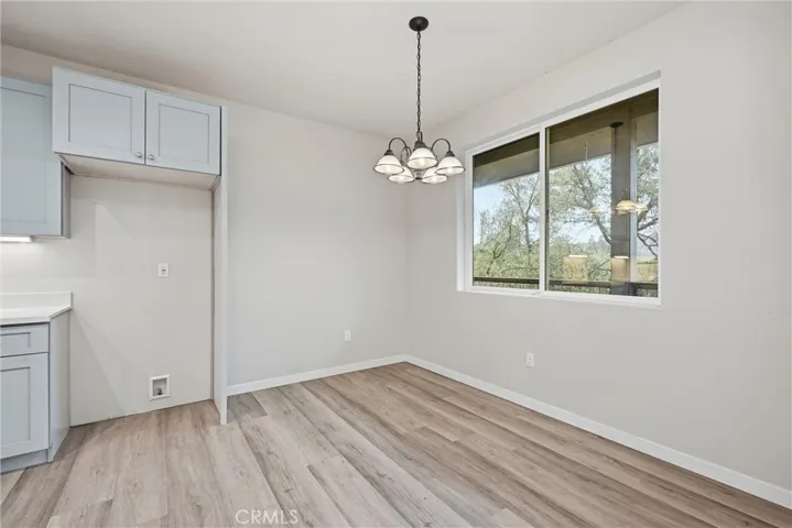 Kitchen nook has lovely views of the backyard.