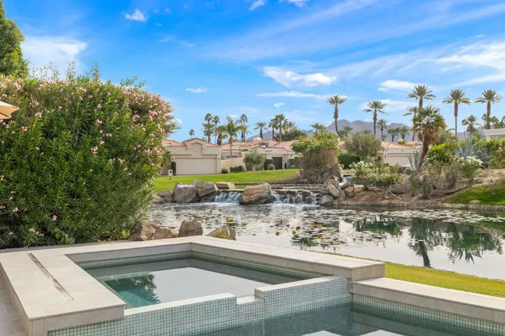 Backyard spa pond waterfall view