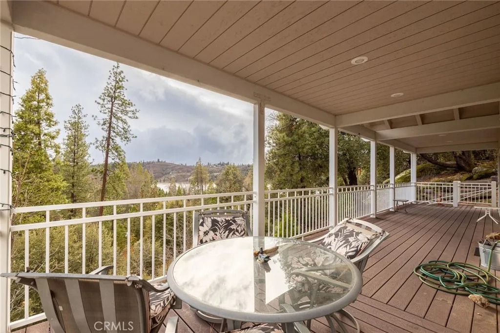 covered deck with lake views
