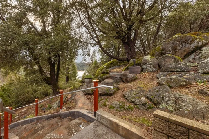 stairs leading to garage level distant lake views