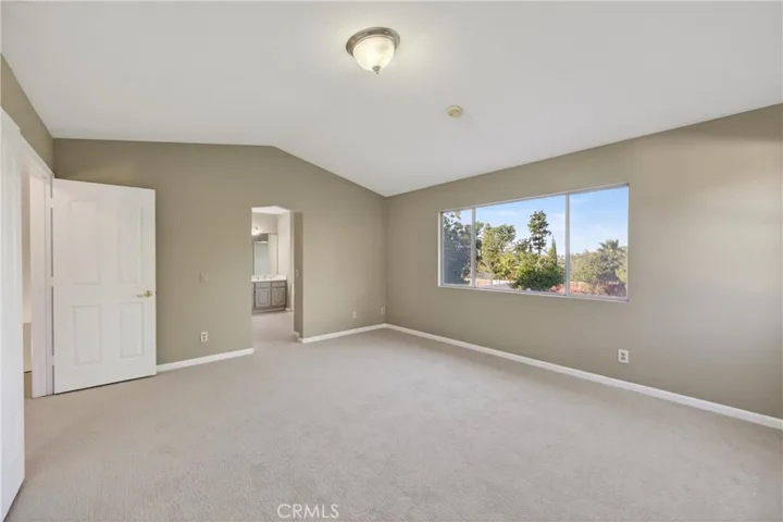 Large primary bedroom with an open, airy design