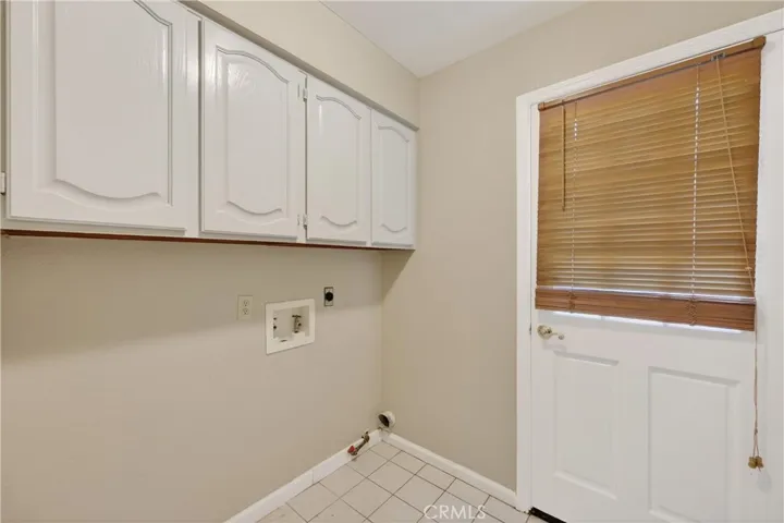 Separate laundry room with plenty of storage