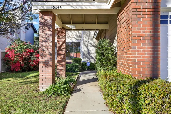 Welcoming front entry with covered walkway