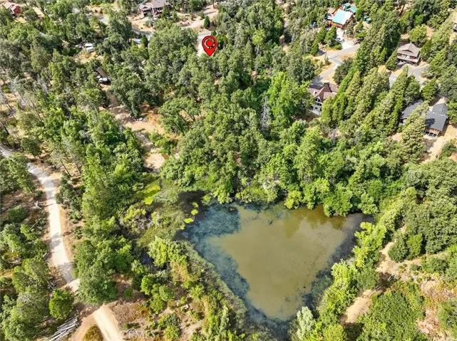 Direct access from backyard to fishing pond.