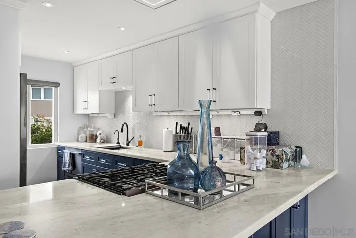 Kitchen was remodeled in 2021 with beautiful cabinetry,  quartzite counter tops, top of the line under cabinet system (Legrand Adorne Under-Cabinet Lighting and Power System), Bosch gas range, Faber vent hood)