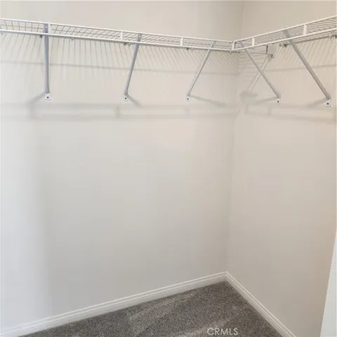 middle bedroom with walk-in closet