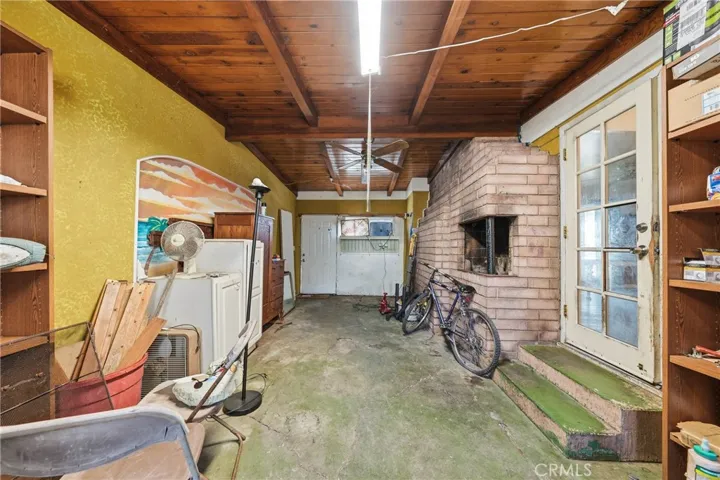 Partially converted garage with street entrance.