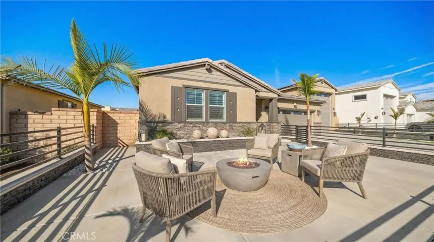 Pure class starting from the front entrance with wrought iron gates and stone veneer - Virtually Staged