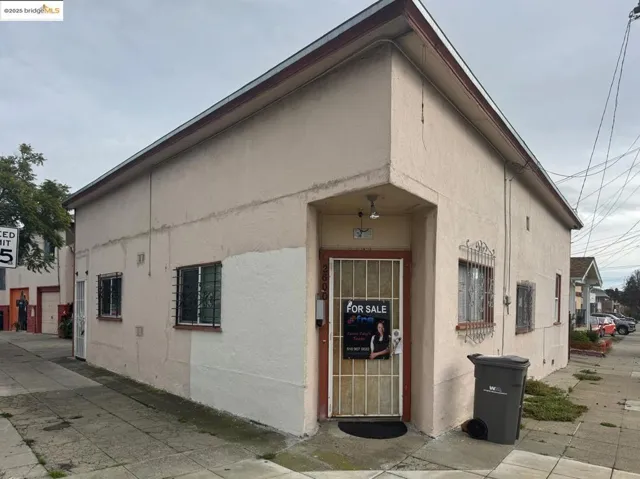 View of building exterior featuring a garage