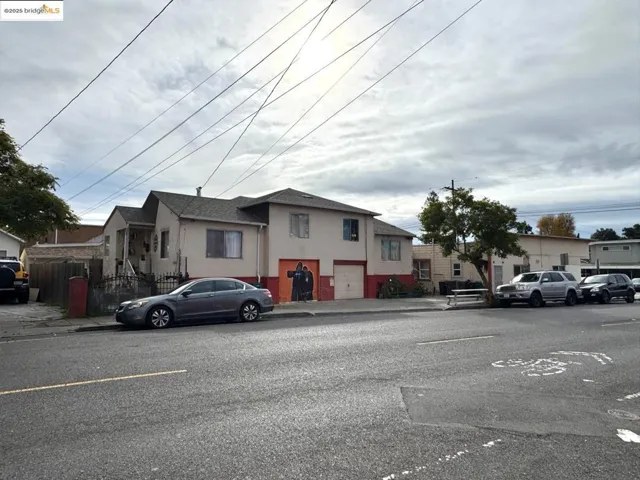 View of front of house featuring stucco siding and a residential view