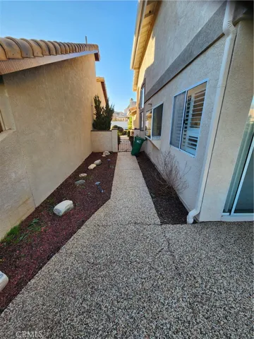 Rear patio side yard entrance