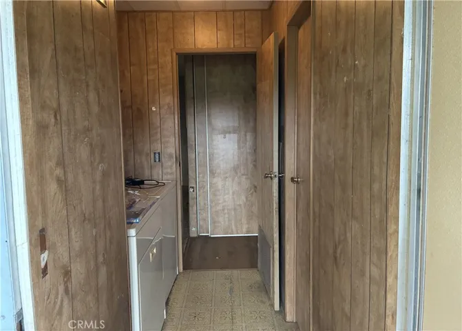 Laundry towards hallway. Door on right is to hallway bathroom.