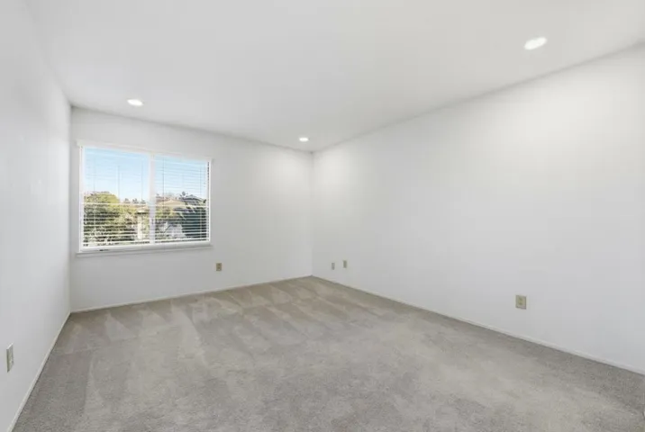 Large bedroom with LED can lighting.