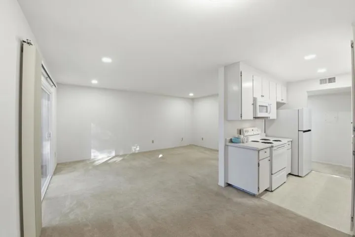 Dining space opens to the living room and kitchen.