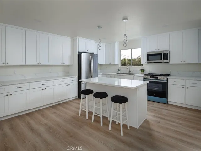 Kitchen has lots of cabinets and counter space