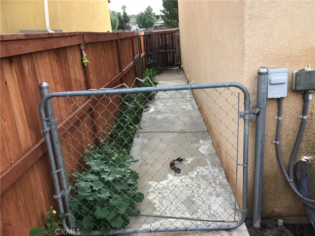 backyard dog run fenced to front gate