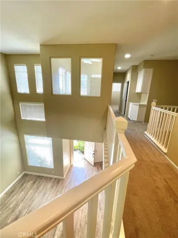 View from master bedroom to loft on left, laundry room on right, and secondary bedroom