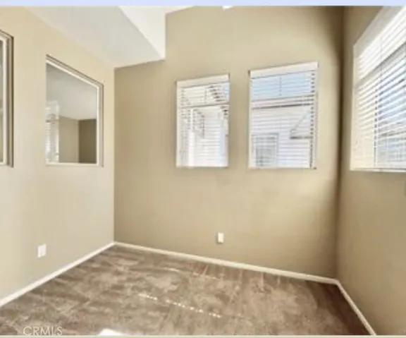 Enclosed loft with fan and lots of windows from second floor.