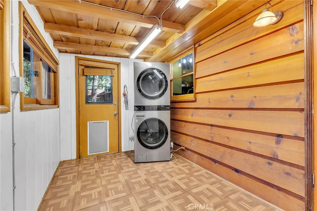 Laundry room with stacked washer / dryer