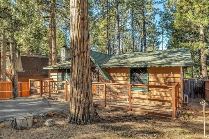 Daytime house picture with lots of mature trees for shade