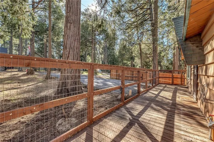 Fully fenced front patio is great to keep pets safe.