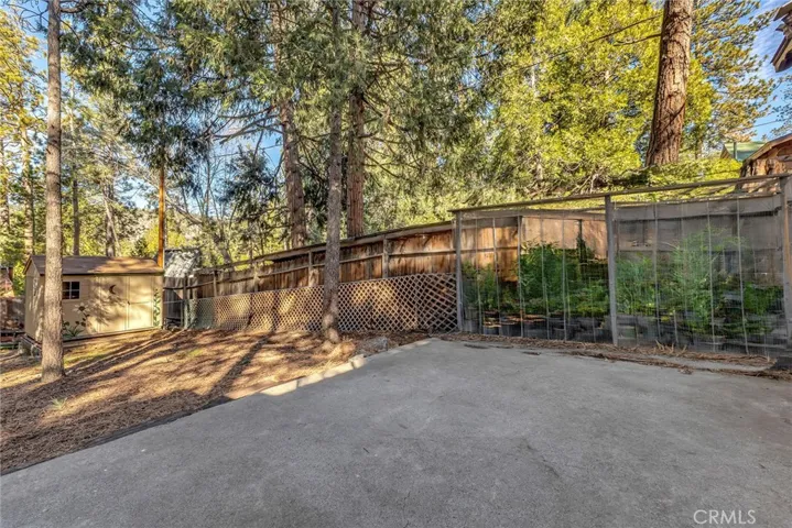 Back patio with covered garden area (staged with plants)