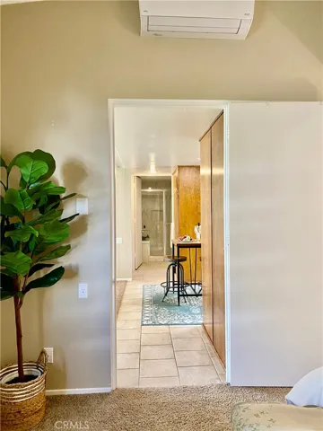 2ND BEDROOM WITH HEAT PUMP....TILED HALLWAY