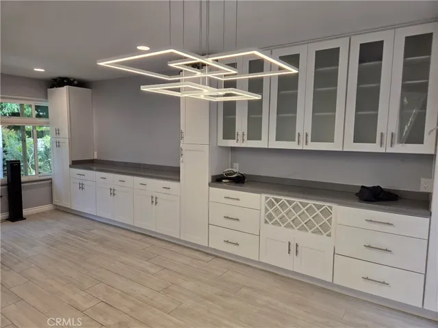 Dining area with built-ins extending into the living room
