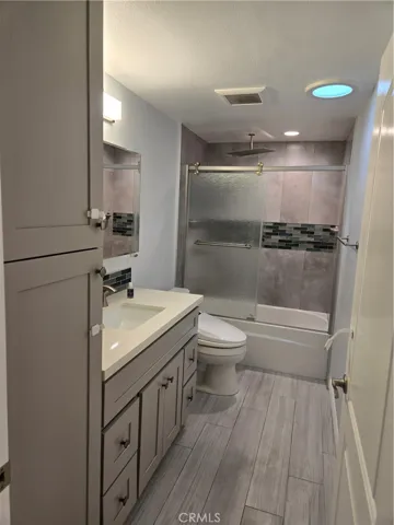 Custom guest bath with storage and tiled shower