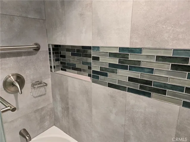 Tiled shower in guest bath